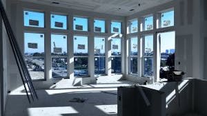 AMLI Treeshouse apartment interiors showing drywall construction underway and many windows looking outside