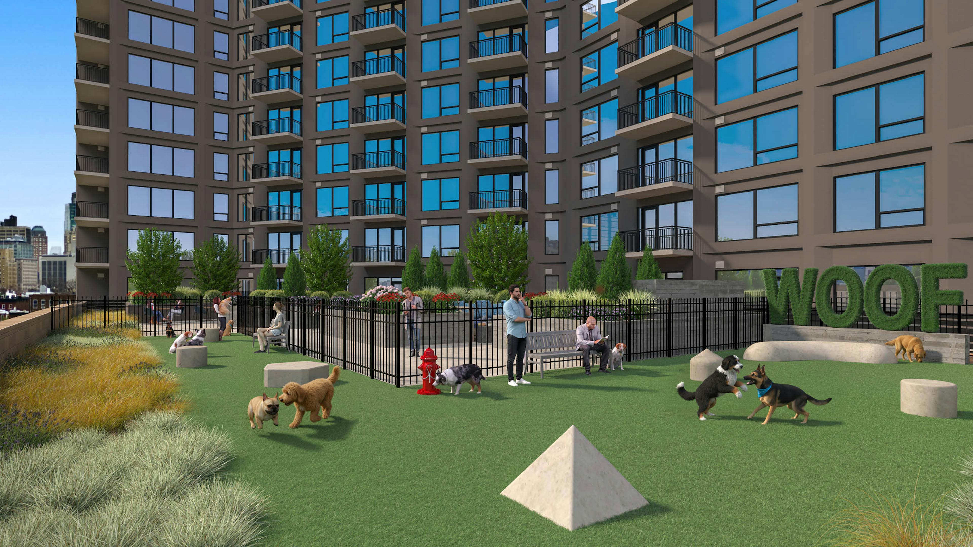 Exterior view of rooftop terrace with outdoor pool and lounge chairs and landscaped plants at AMLI Golden Triangle.