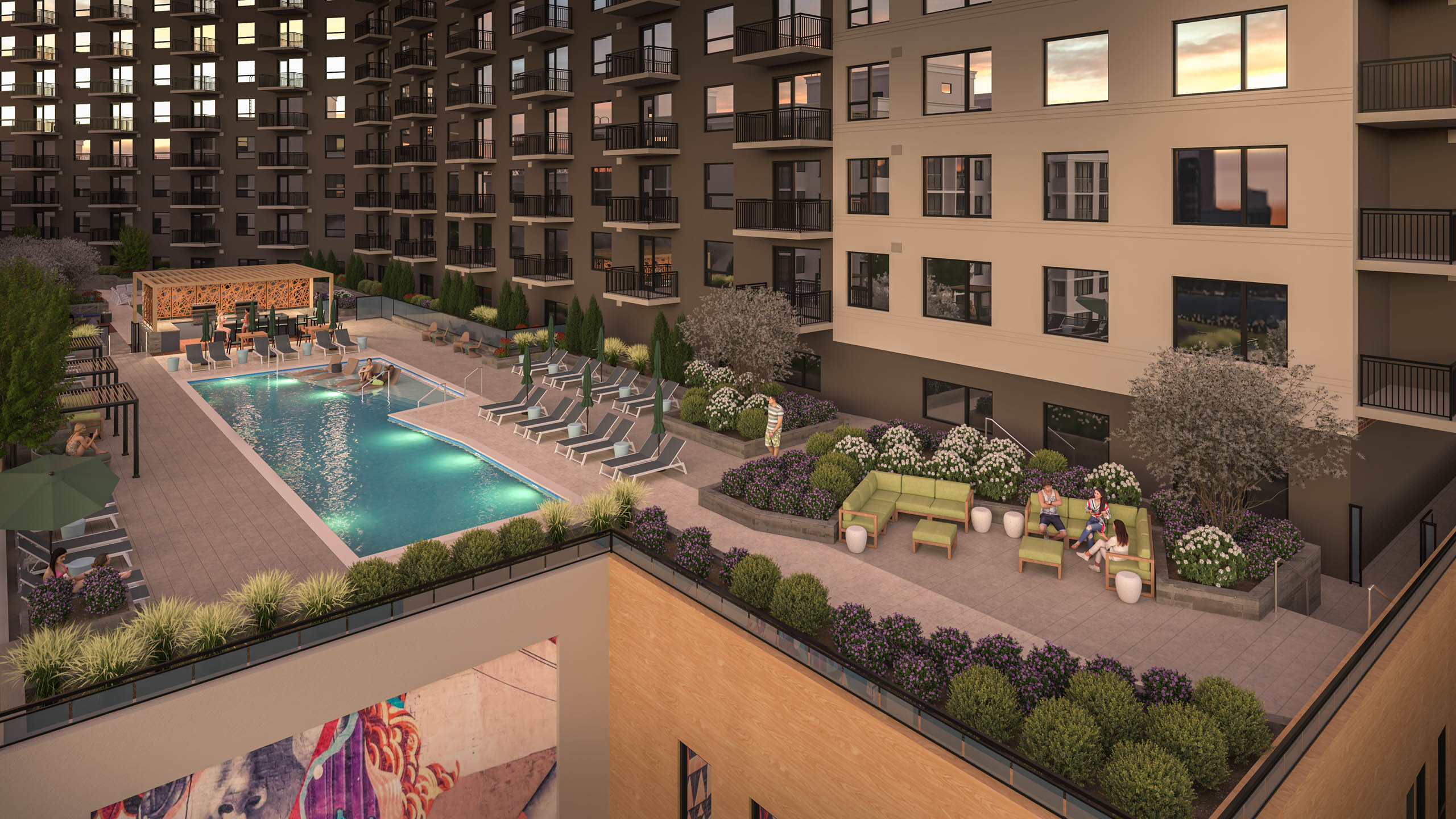 Exterior view of rooftop terrace with outdoor pool and lounge chairs and landscaped plants at AMLI Golden Triangle.