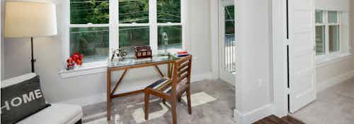 AMLI Piedmont Heights sunroom with carpet and large windows for natural light which is an extension of the living room