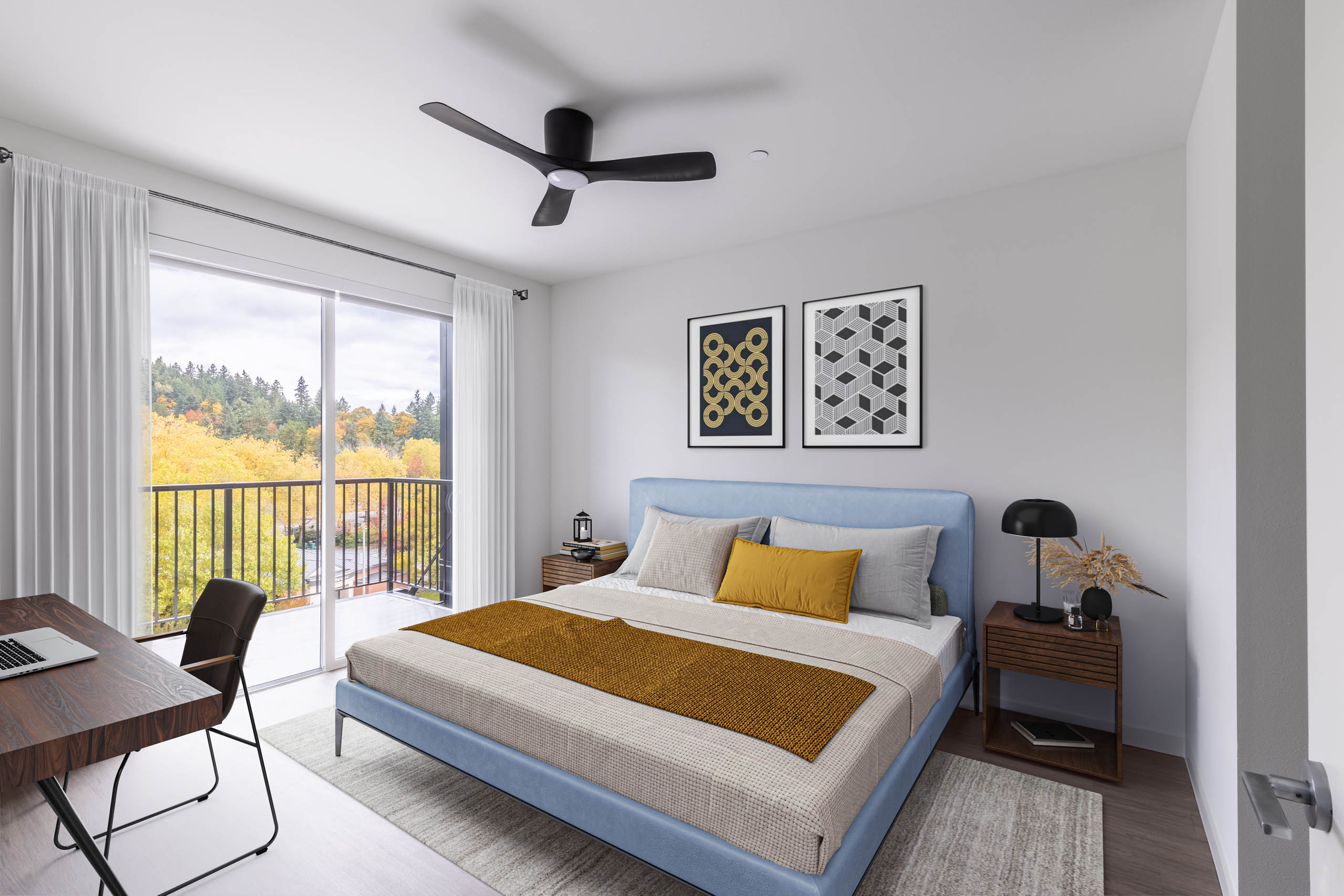 Apartment bedroom at AMLI Redmond Way featuring a large bed with a blue headboard and floor to ceiling windows that face tall trees
