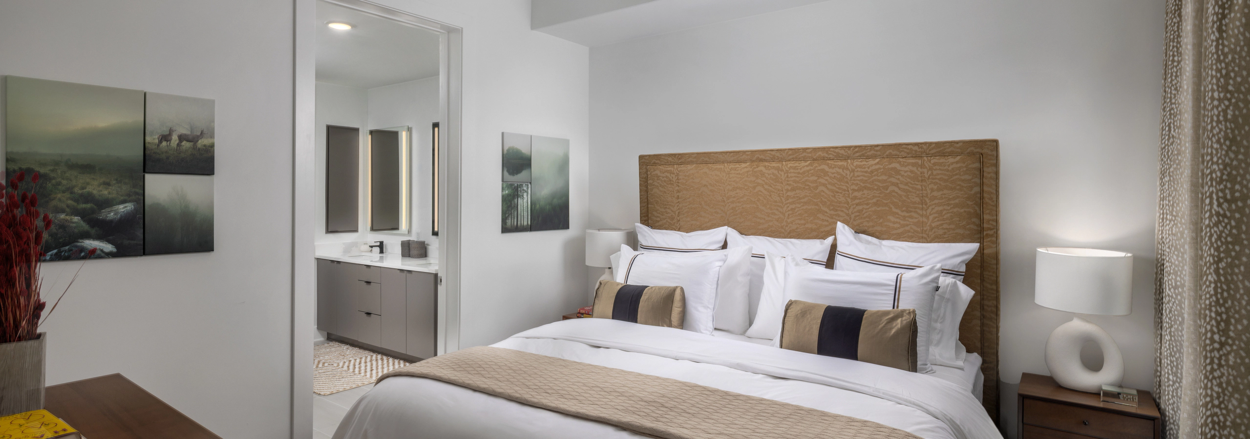 Bedroom at AMLI Atlantic Station with ceiling fan and en suite bathroom