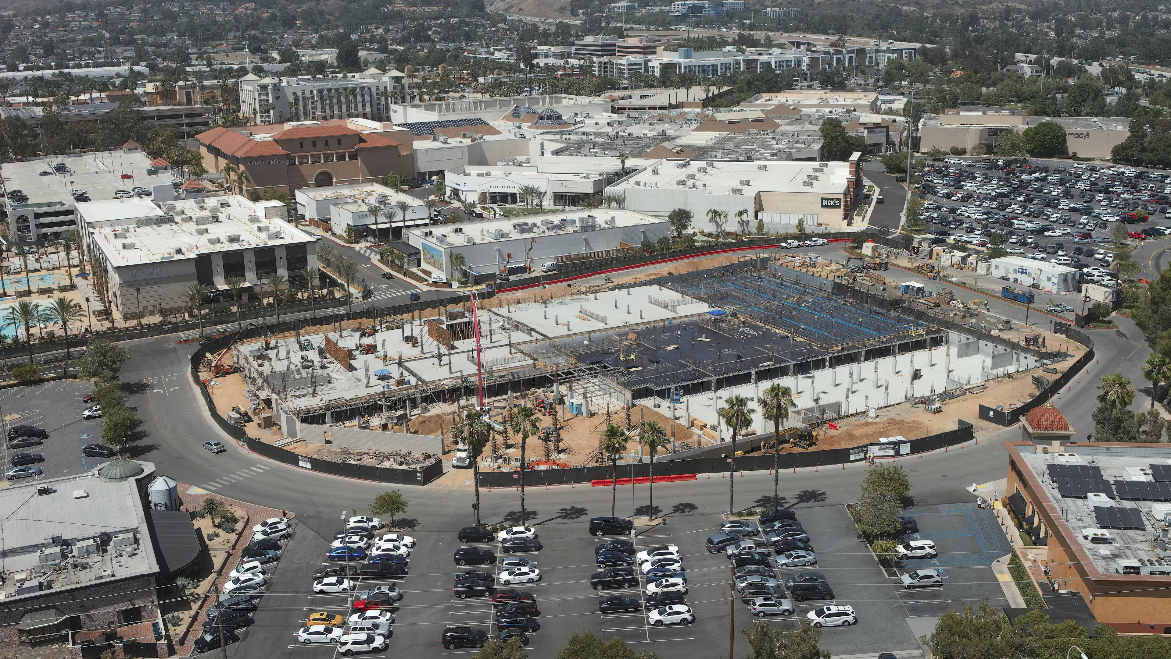 Aerial shot of AMLI Brea construction site with concrete being poured on the second level