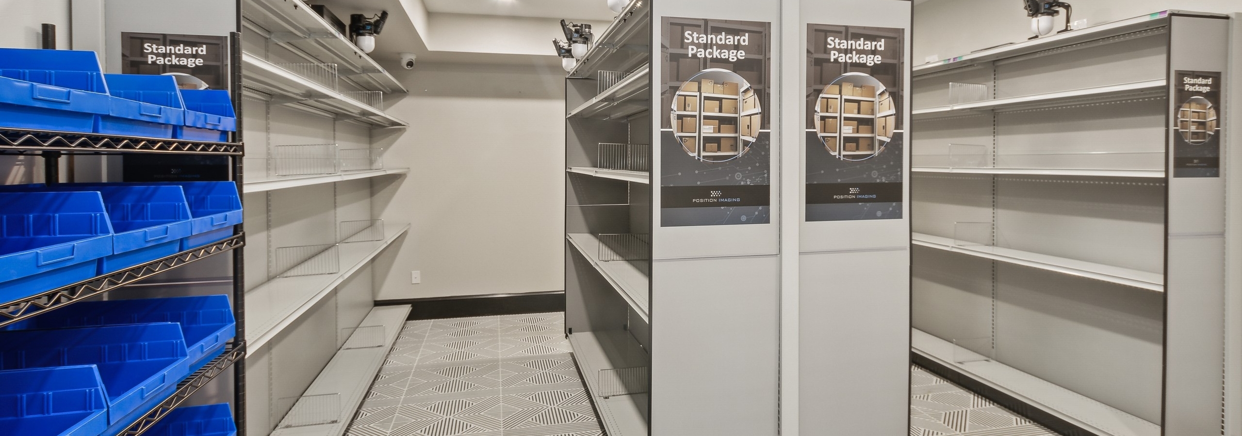 Resident package room at AMLI Campion Trail apartments with gray racking for standard packages and blue bins for flat packages