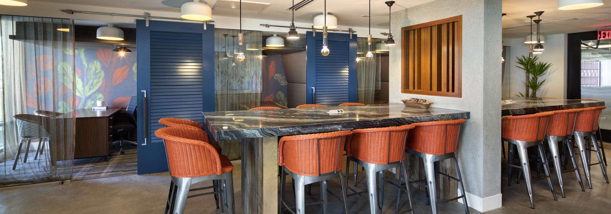 Interior view of AMLI Marina Del Rey apartment Dockwork co-working area with private offices and blue sliding barn doors