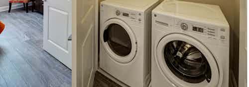 Closeup of full size side by side front loading washer and dryer appliance inside of a closet at AMLI Deerfield