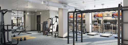 Interior of AMLI Quadrangle fitness center with various cardio and weight exercise equipment with grey flooring and tan walls