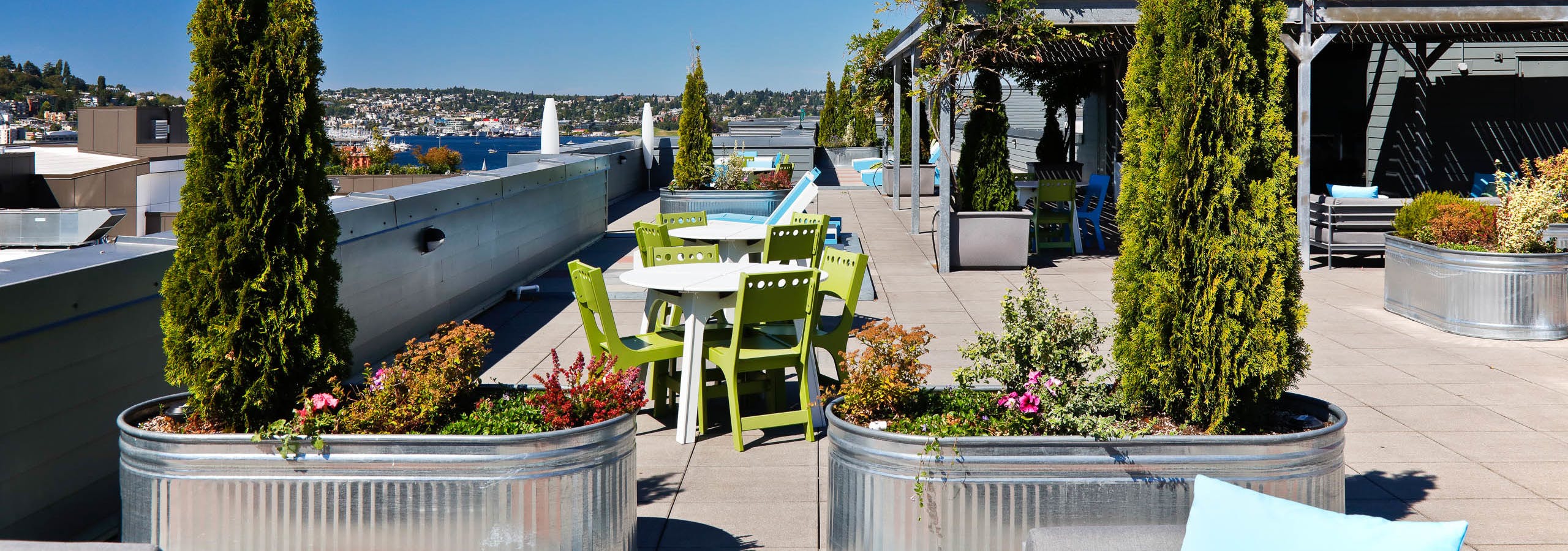 Rooftop view of AMLI 535 with patio seating and view of South Lake Union