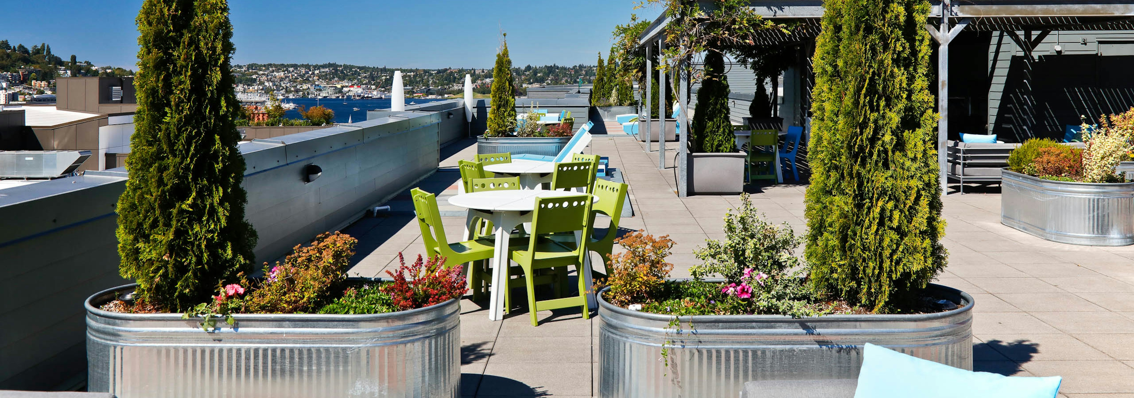 Rooftop view of AMLI 535 with patio seating and view of South Lake Union