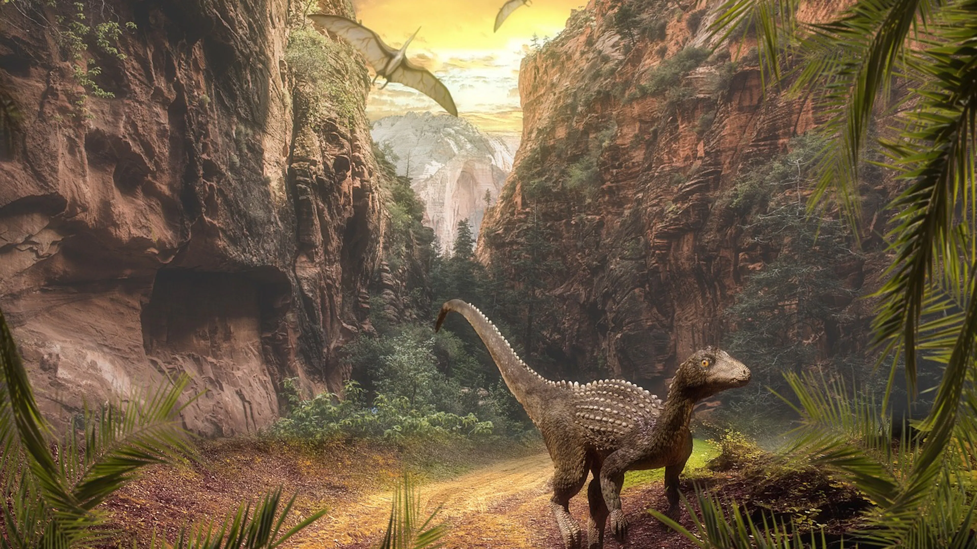 Artwork depicting a lush landscape with a dinosaur running toward the viewer with a waterfall in the background