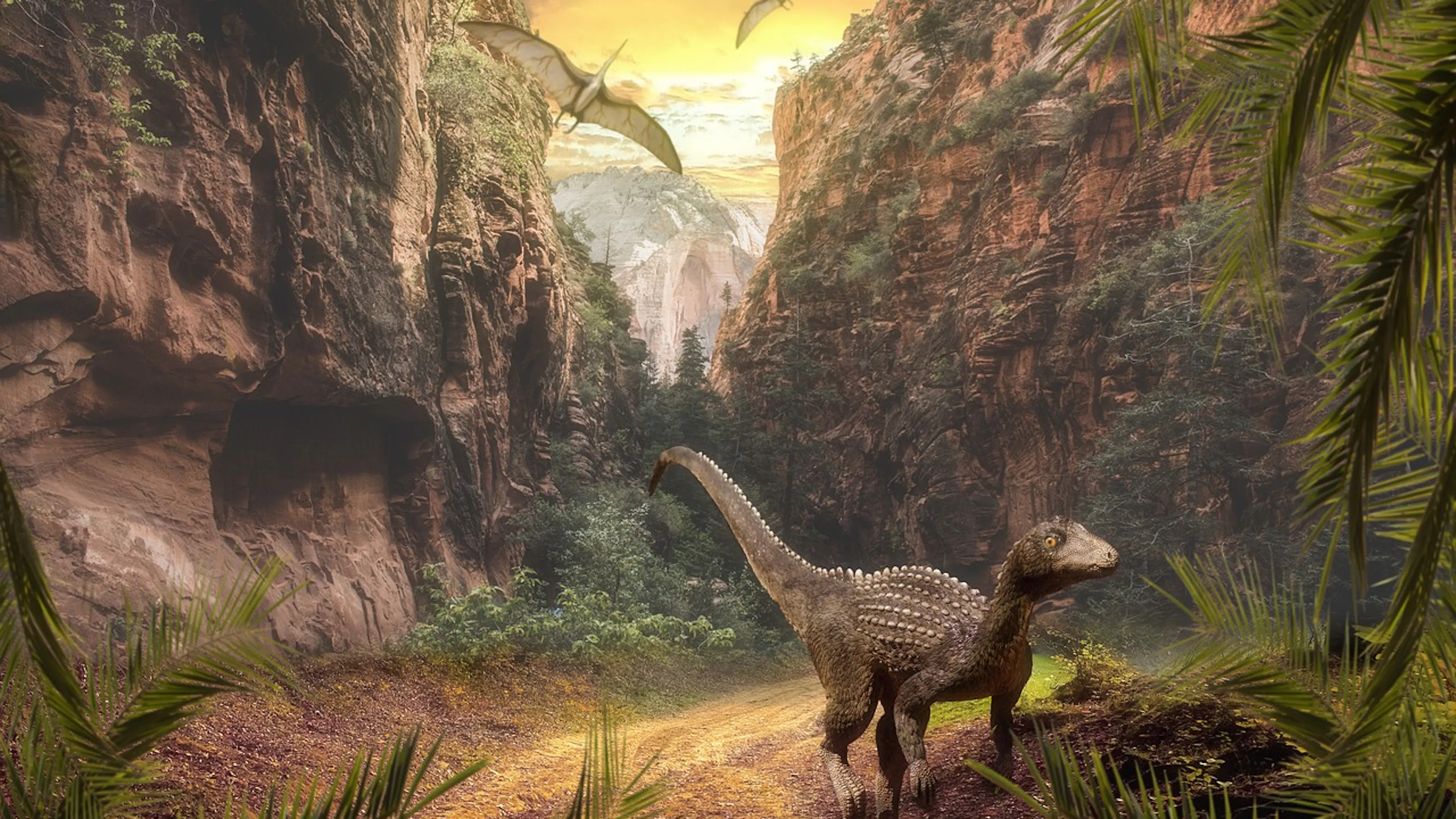 Artwork depicting a lush landscape with a dinosaur running toward the viewer with a waterfall in the background