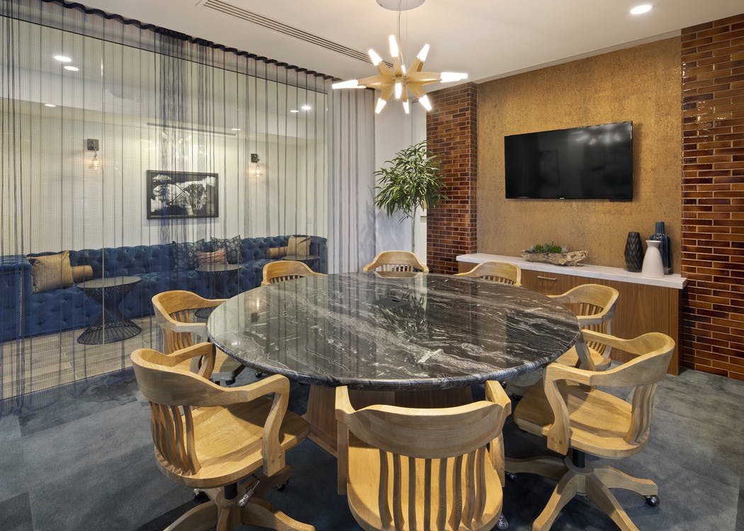 Interior daytime view of AMLI Marina De Rey apartment laptop lounge with individual work desks and unique rope style curtains