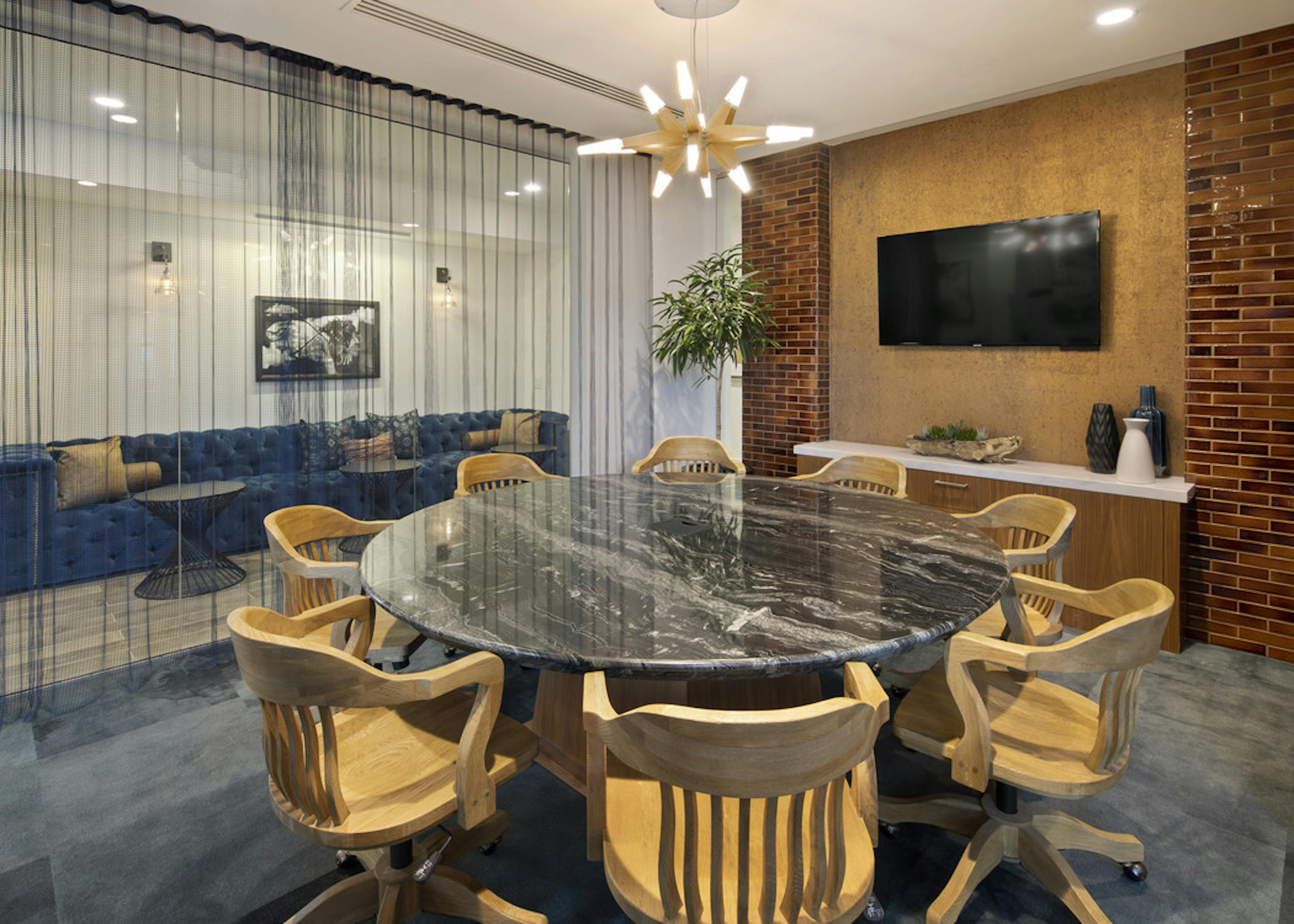 Interior daytime view of AMLI Marina De Rey apartment laptop lounge with individual work desks and unique rope style curtains