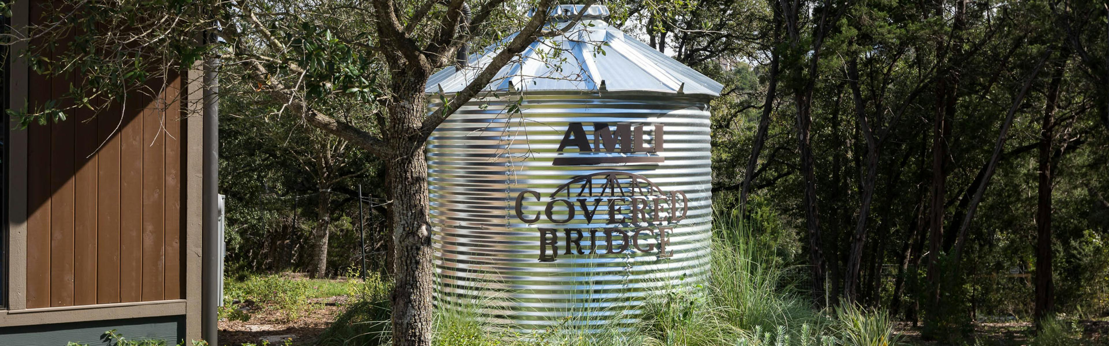 AMLI Covered Bridge water tank tucked away in the greenery surrounding the community