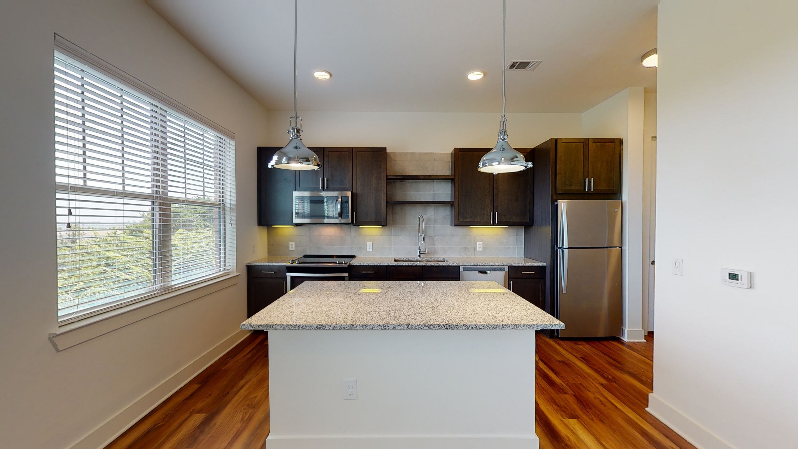 AMLI Grapevine kitchen island and cabinets with lighting