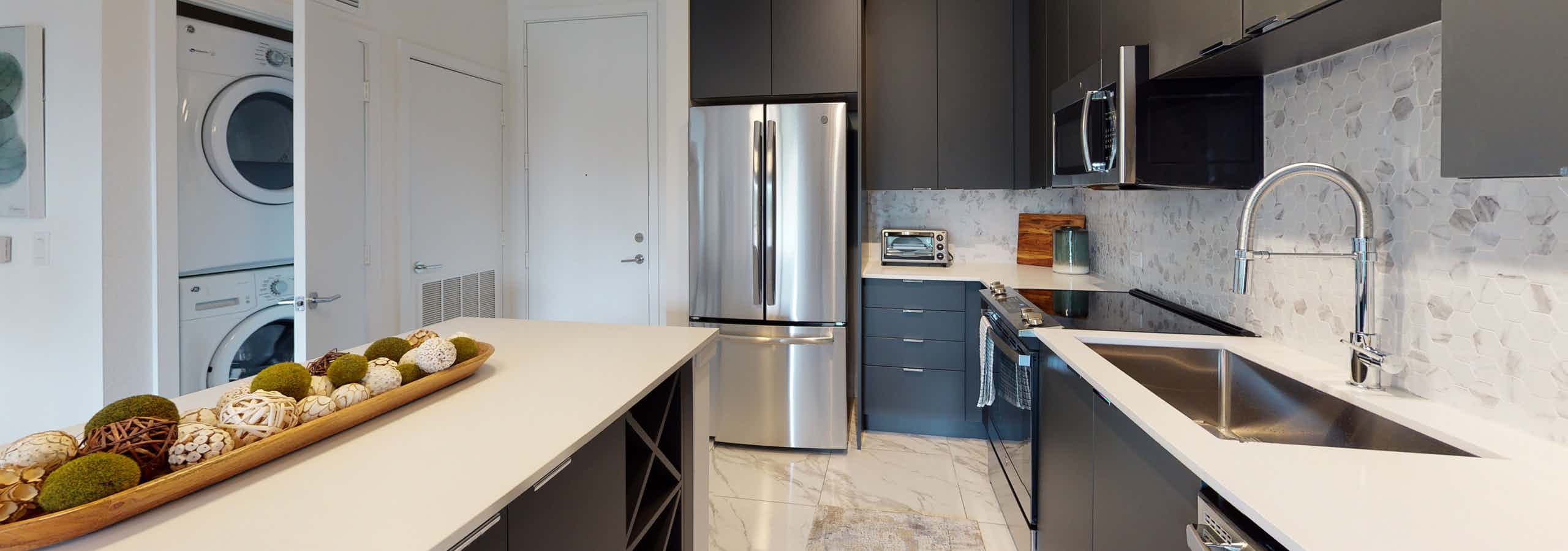 Island kitchen with elegant quartz countertops