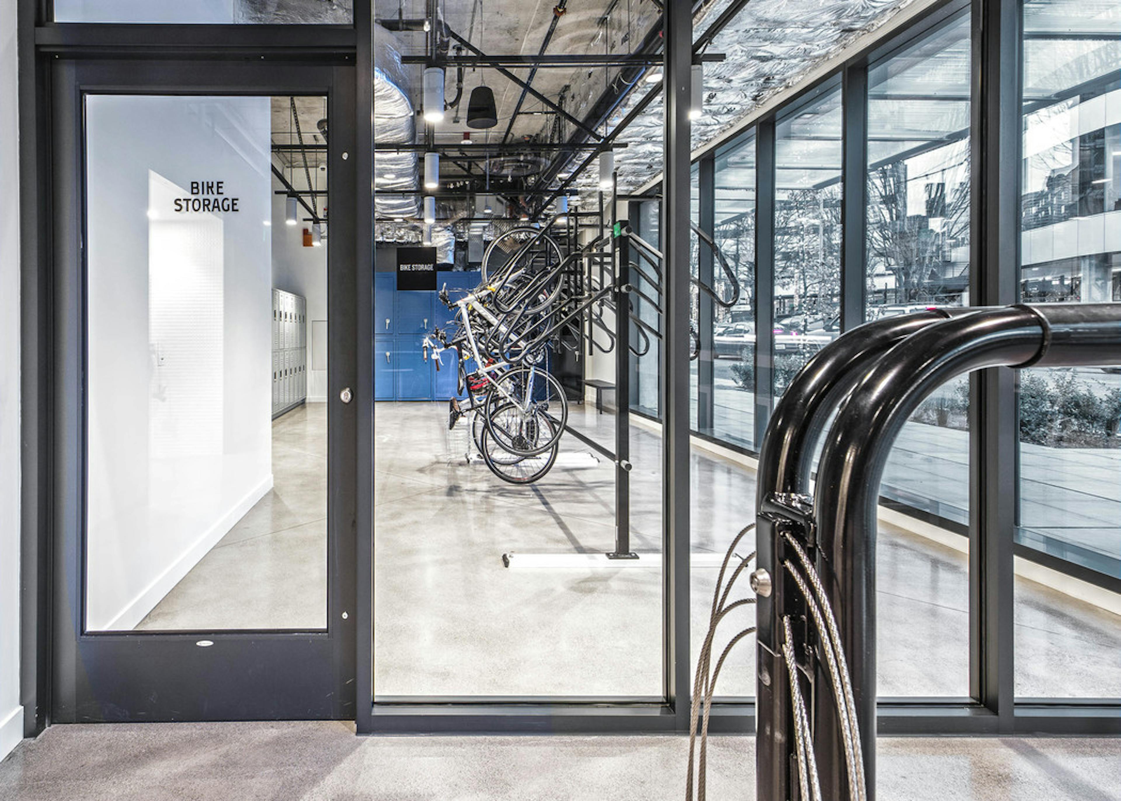 Interior bike lounge with bike storage bike tools bike shower and storage lockers with access to the street at AMLI Arc 