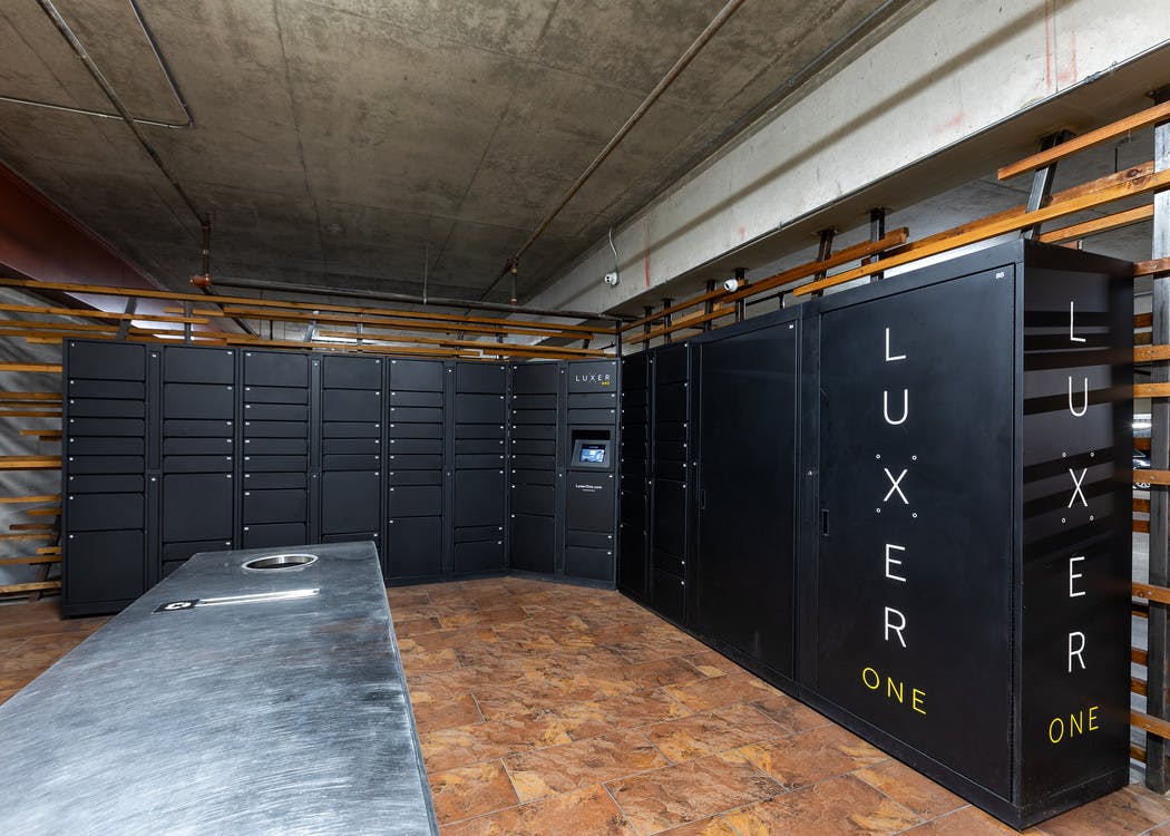 Interior view of AMLI 300 Luxer Mail-room with individual lockers and individual mail boxes for each apartment home