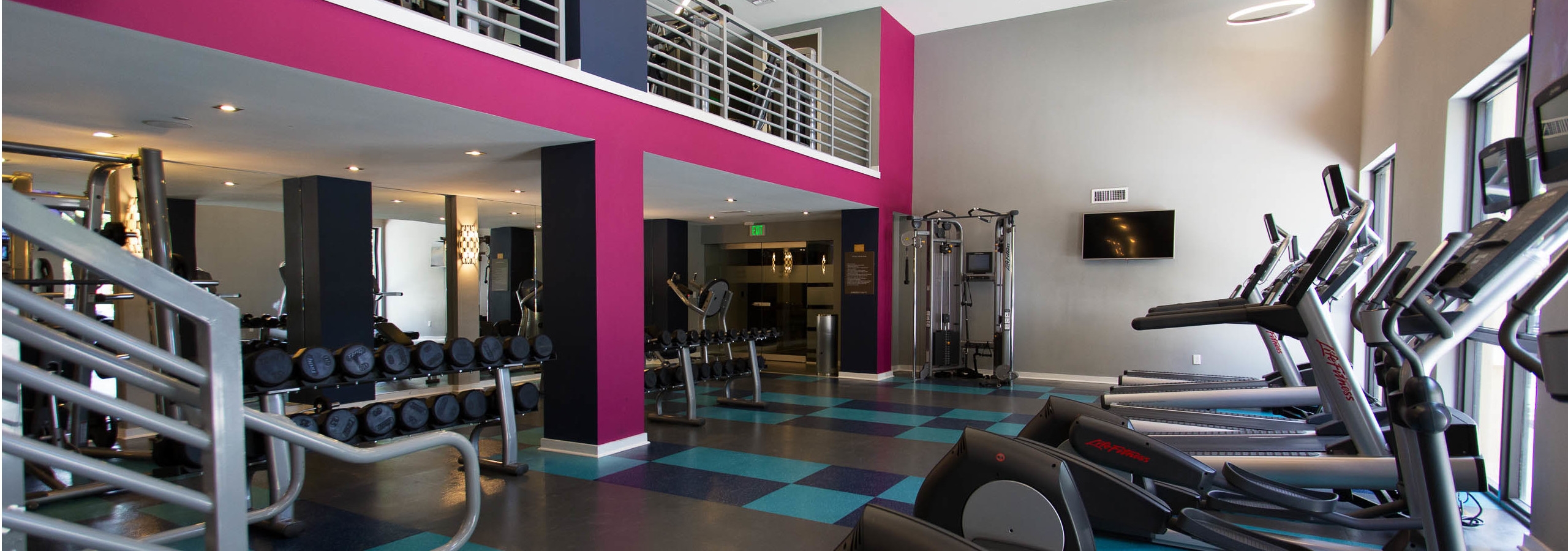 Two Story Fitness Center at AMLI Dadeland equipped with treadmills and high endurance