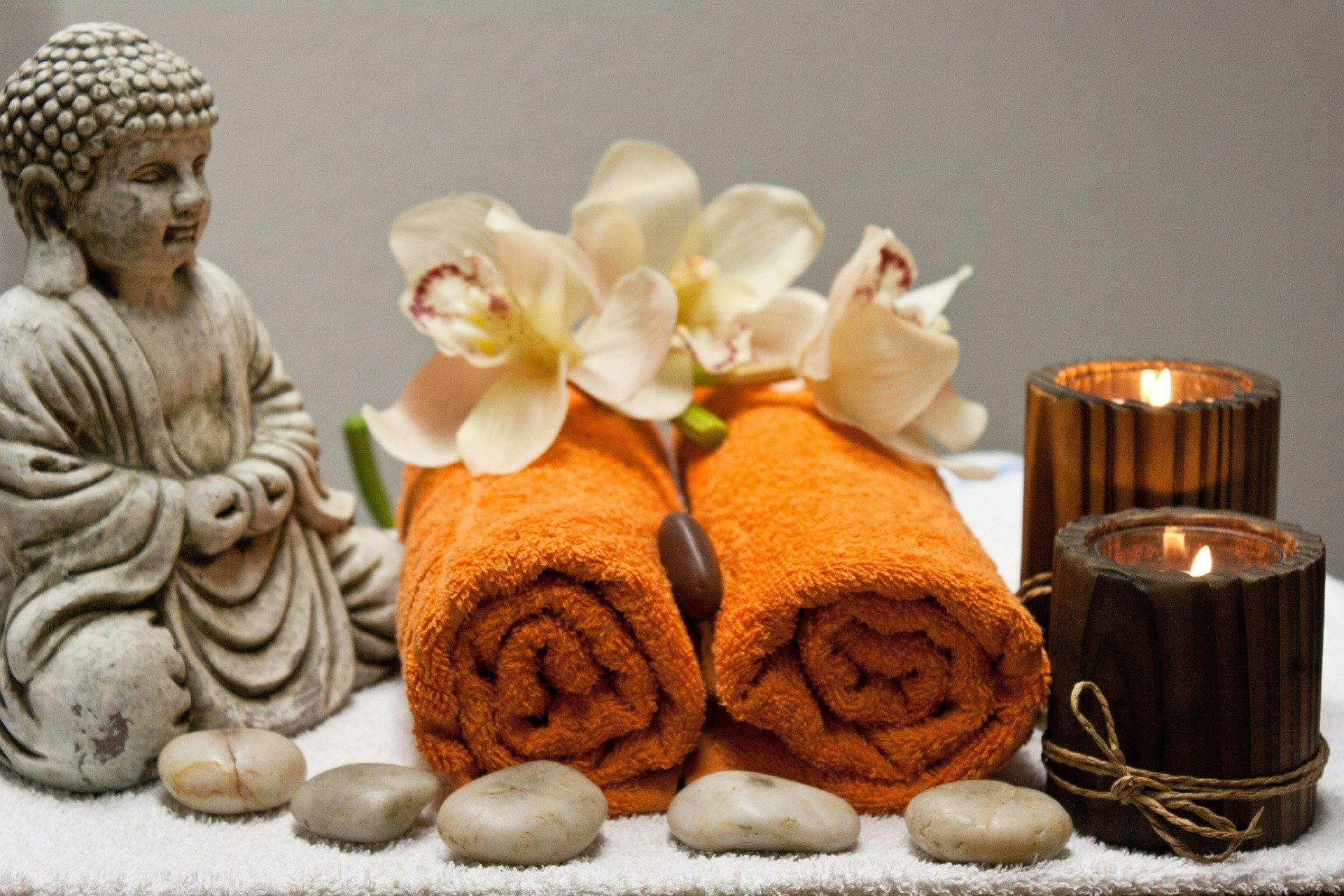 Spa day treatment with towels and candles