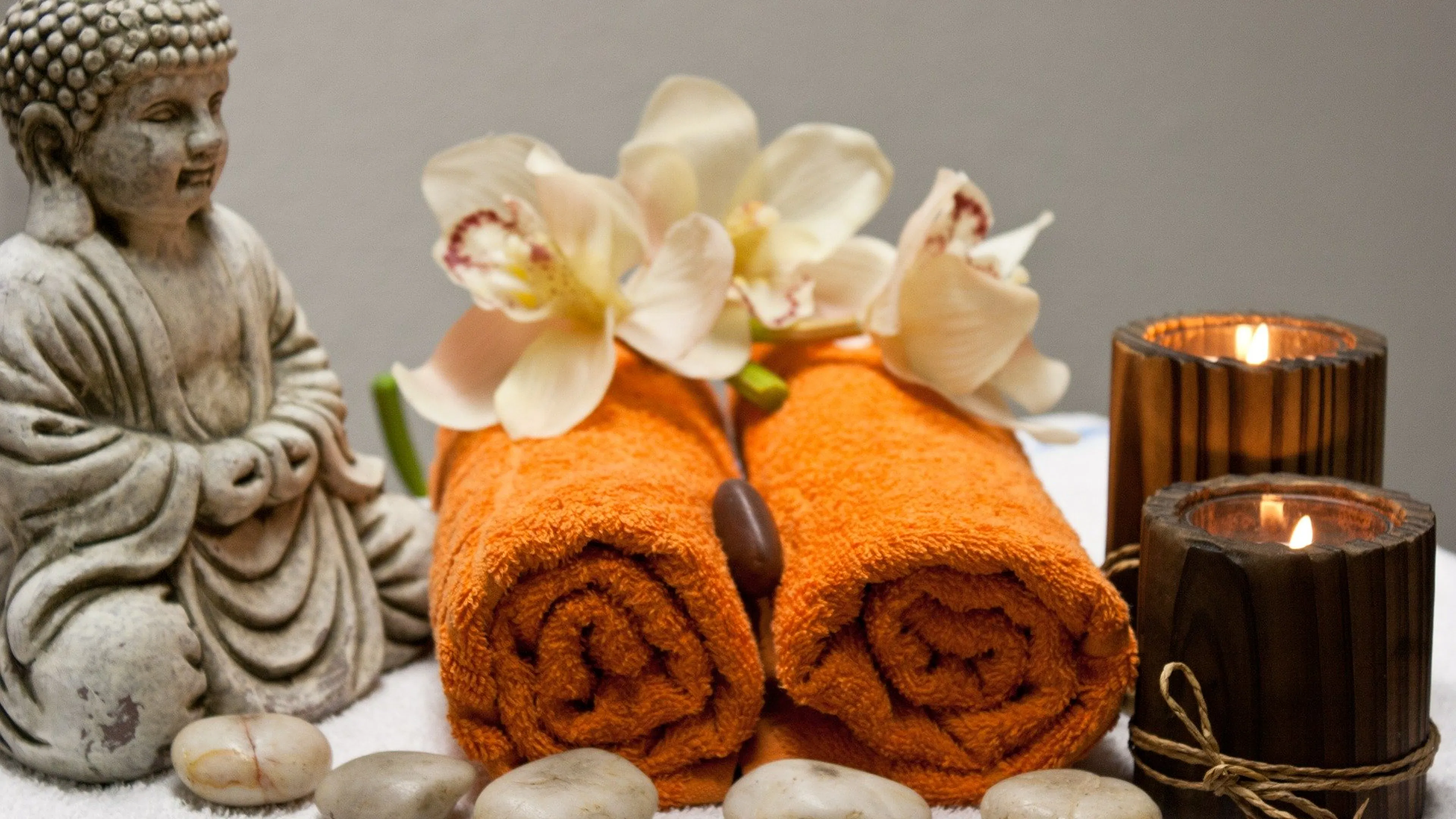 Spa day treatment with towels and candles