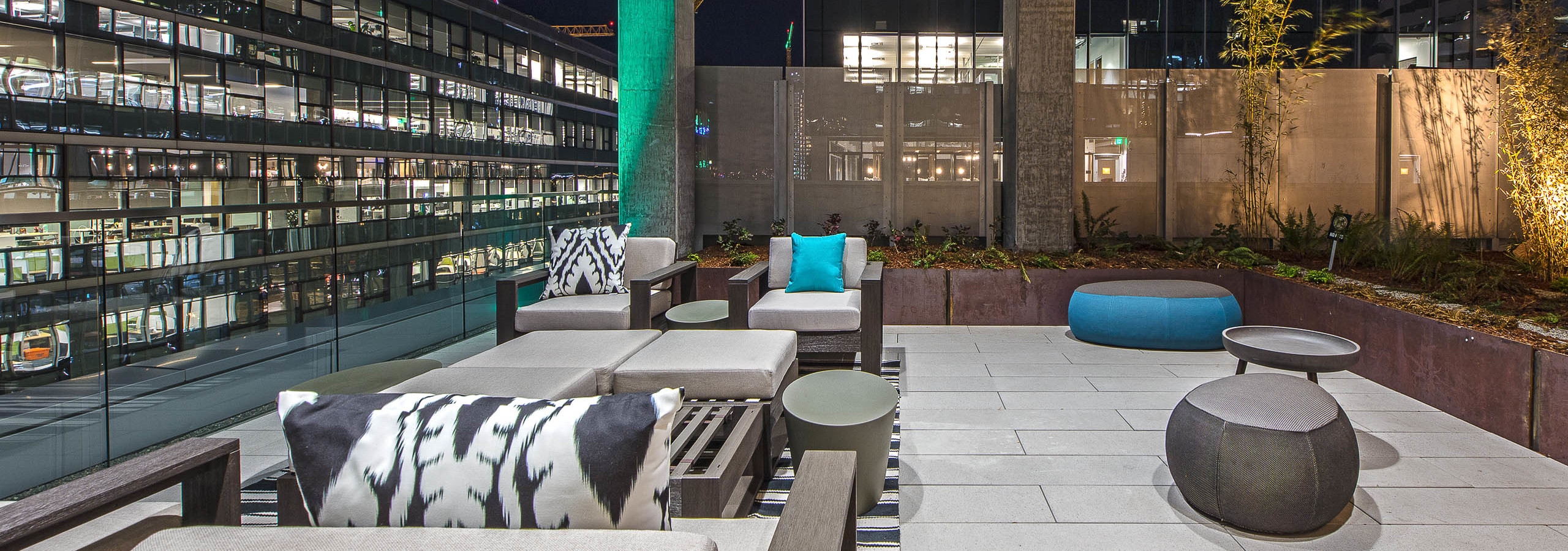 Exterior deck of AMLI Arc with seating and views of Downtown Seattle