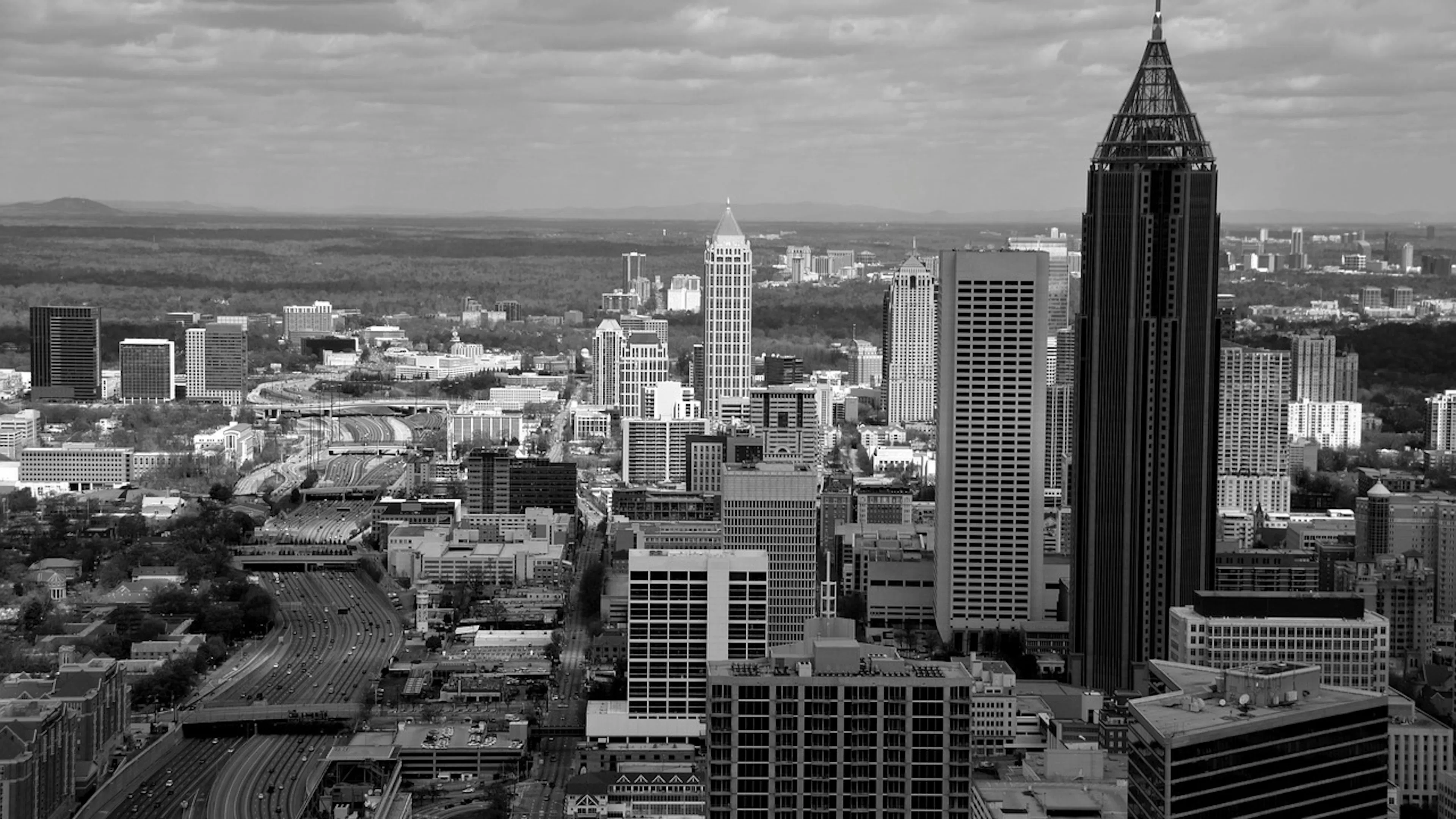 An aerial view of Atlanta on a sunny day but the photo is in black and white