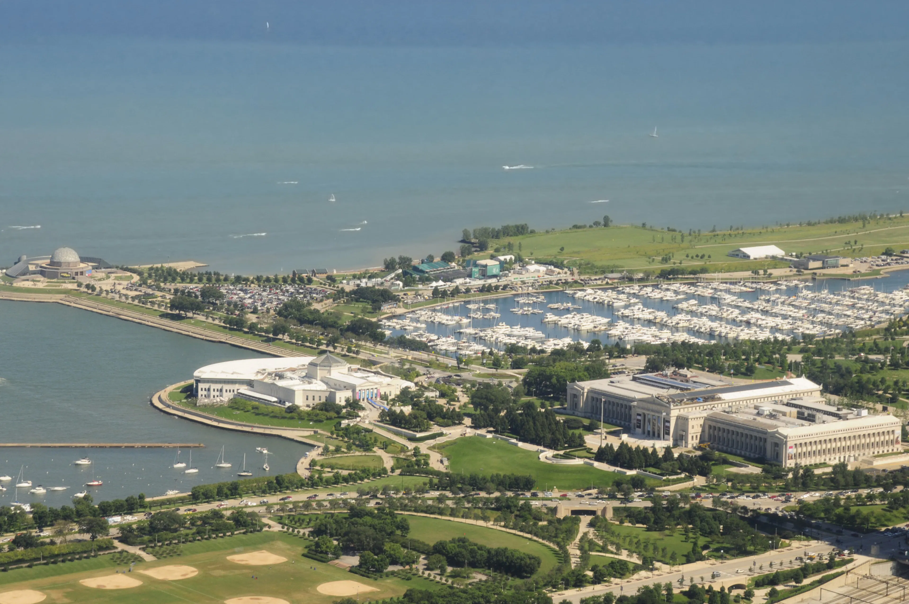 Aerial view of the Chicago museum campus showing Alder Planetarium and Shedd Aquarium and Field Museum and Soldier Field