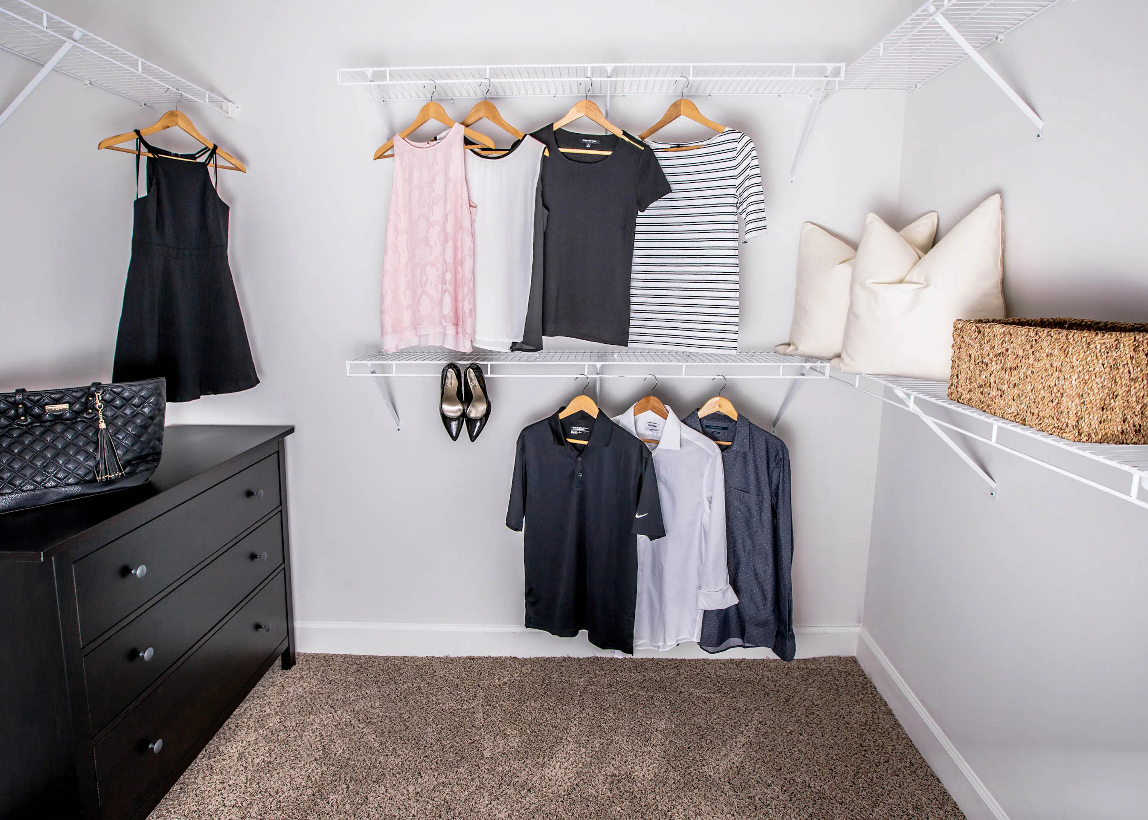 AMLI Joya big closet with black dresser and clothes hanging up.