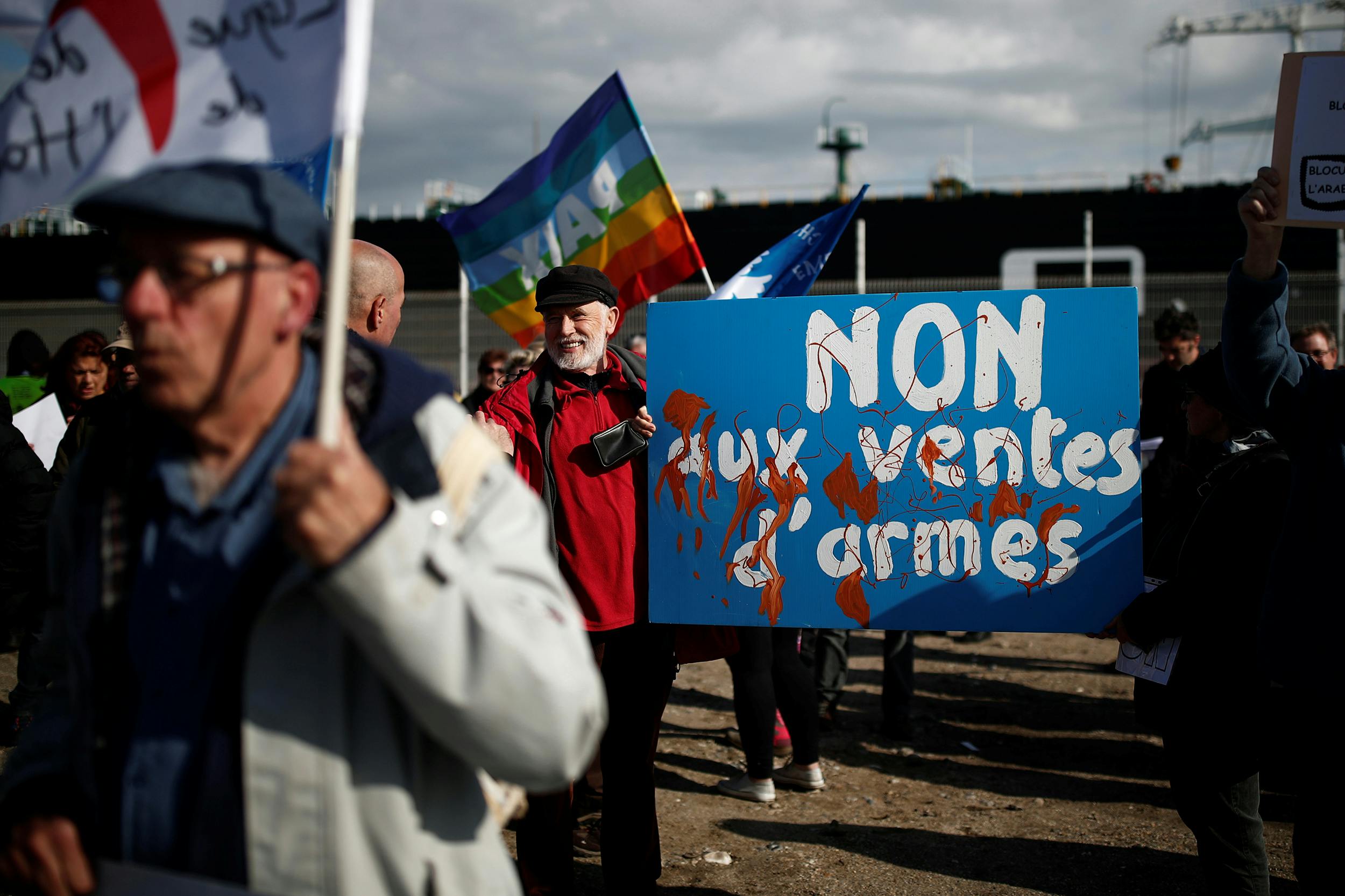 People attend a demonstration to protest against the loading of weapons aboard the Bahri-Yanbu, a cargo ship operating for Saudi Arabia's defence and interior ministries, in Le Havre, France, May 9, 2019. The banner reads: "No to arms sales". 