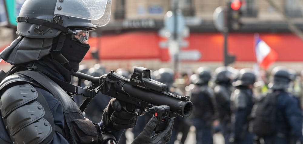 Police officers use their LBD-40 rifle (FLashball type) to keep the crowd at bay. Several thousand people claiming to be part of the so-called Yellow Jackets (" Gilets Jaunes ") movement took part in the demonstration of Act 13 in the streets of Paris. The demonstration took place between the Champs-ElysÈes and the Champ de Mars with many acts of violence along the way. Paris, France, February 9, 2019. Photo by Samuel Boivin/ABACAPRESS.COM