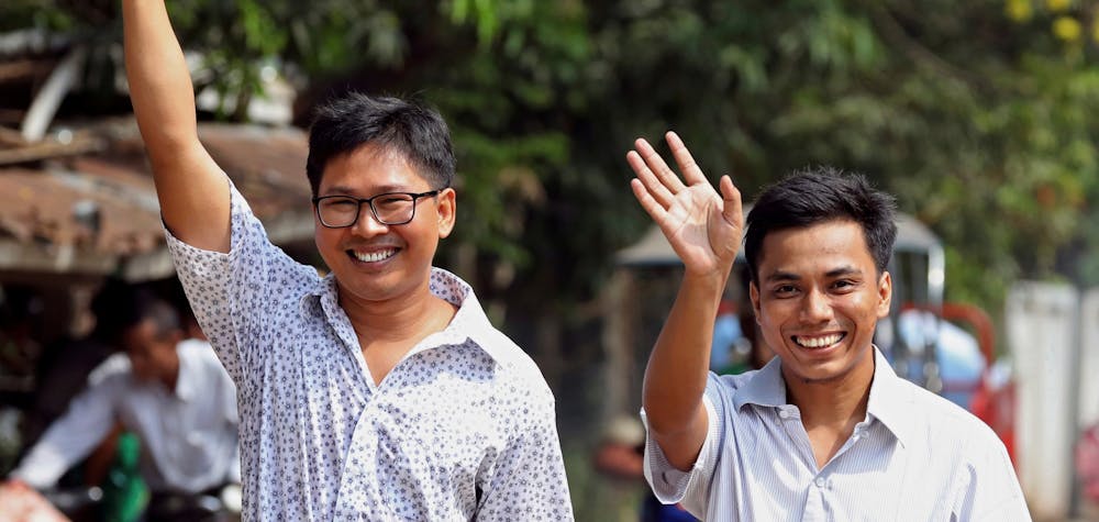 Reuters reporters Wa Lone and Kyaw Soe Oo gesture as they walk free outside Insein prison after receiving a presidential pardon in Yangon, Myanmar, May 7, 2019. REUTERS/Myat Thu Kyaw TPX IMAGES OF THE DAY