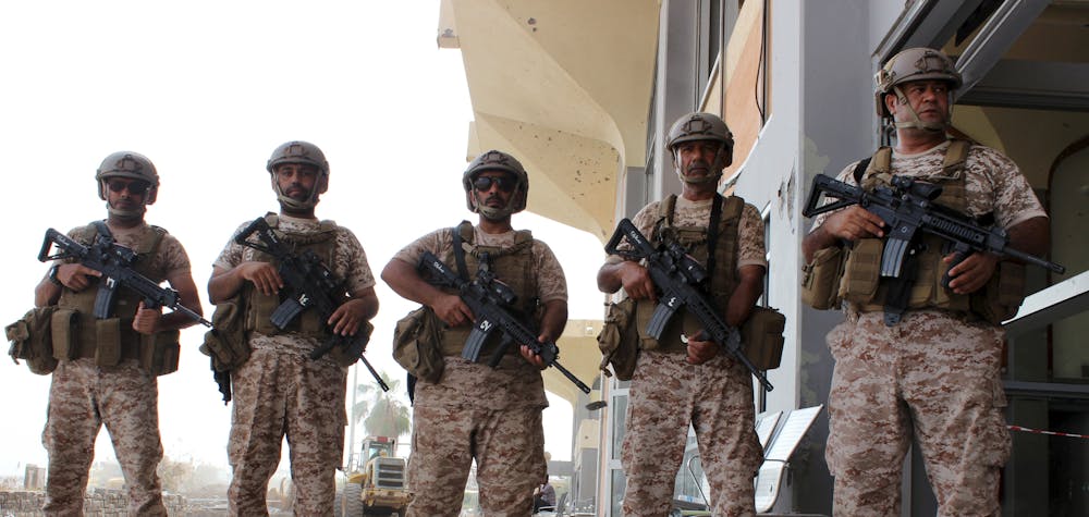 Soldiers from the United Arab Emirates stand guard at the airport of Yemen's southern port city of Aden August 8, 2015. Soldiers from the United Arab Emirates, at the head of a Gulf Arab coalition fighting Iran-allied Houthi forces in Yemen, are preparing for a long, tough ground war from their base in the southern port of Aden. Picture taken August 8, 2015. 