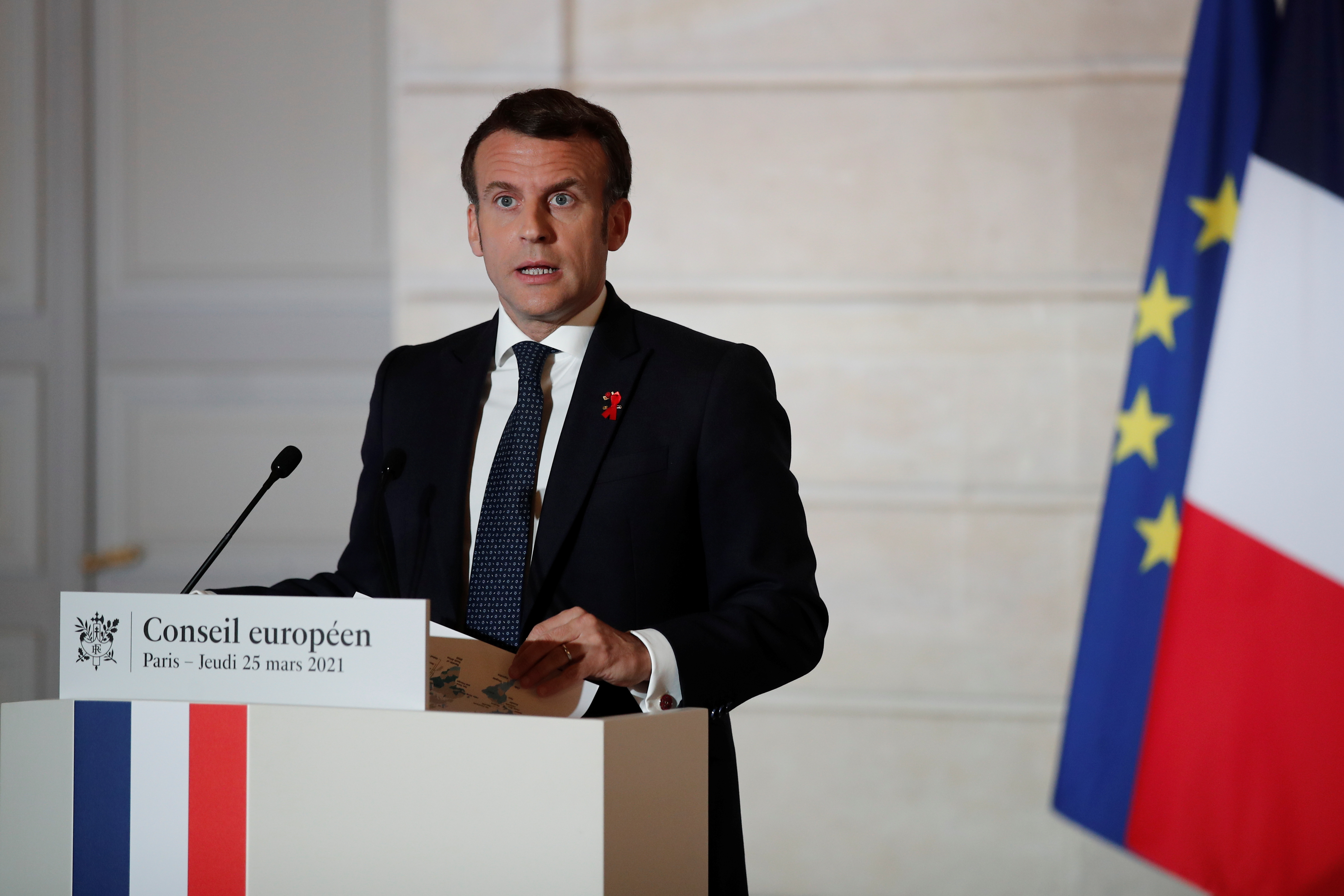 French President Emmanuel Macron delivers a press conference after a European Council summit held over video-conference at the Elysee Palace in Paris, France, March 25, 2021. REUTERS/Benoit Tessier/Pool