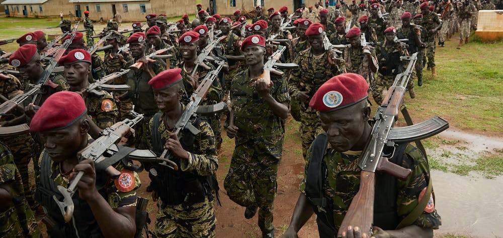  	Personnel of the South Sudan People's Defence Forces (SSPDF), formerly named Sudan People's Liberation Army (SPLA), assigned as South Sundan's presidential guard, take part in a drill at their barracks in Rejaf, about 15km south of Juba, South Sudan, on April 26, 2019. - Though the guard is supposed to be comprised of an even share of former SPLA soldiers and former Sudan People's Liberation Army in Opposition (SPLA-IO) soldiers, the two armies have still not commenced training together despite the deadline for the formation of a unity government fast approaching on May 12. (Photo by Alex McBride / AFP) (Photo credit should read ALEX MCBRIDE/AFP via Getty Images) 