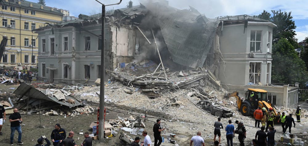 Description: Ukrainian rescuers of emergency services and police officers are working at the site of Okhmatdyt children's hospital damaged by Russian missiles in Kyiv, Ukraine, on July 8, 2024, amid Russia's invasion of Ukraine. At least 27 people are being reported killed and more than 100 injured in a massive Russian missile strike attack on Kyiv this morning, according to local media. (Photo by STR/NurPhoto via Getty Images)