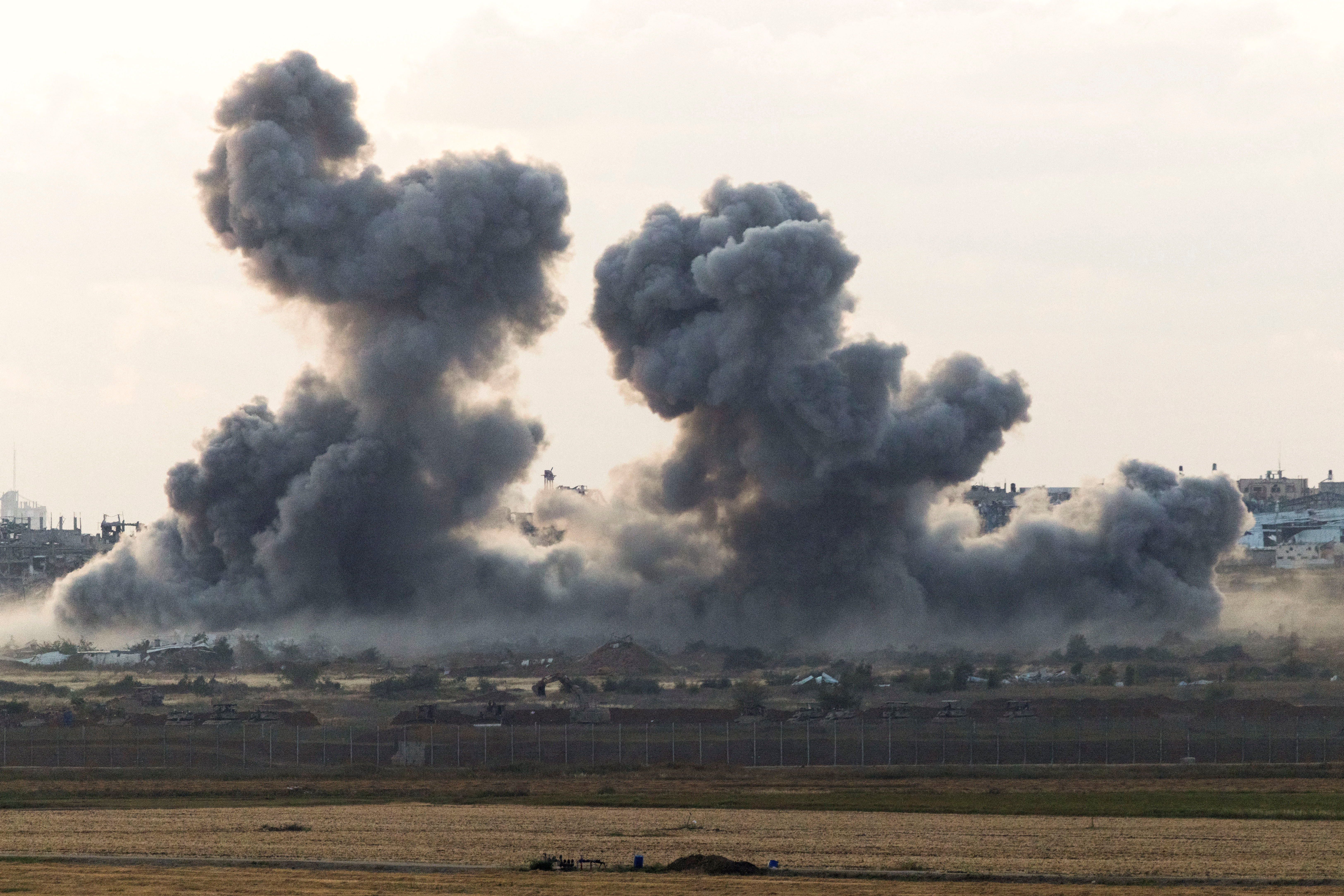 Smoke rises from Gaza after an explosion, as seen from the Israeli side of the border, April 14, 2025