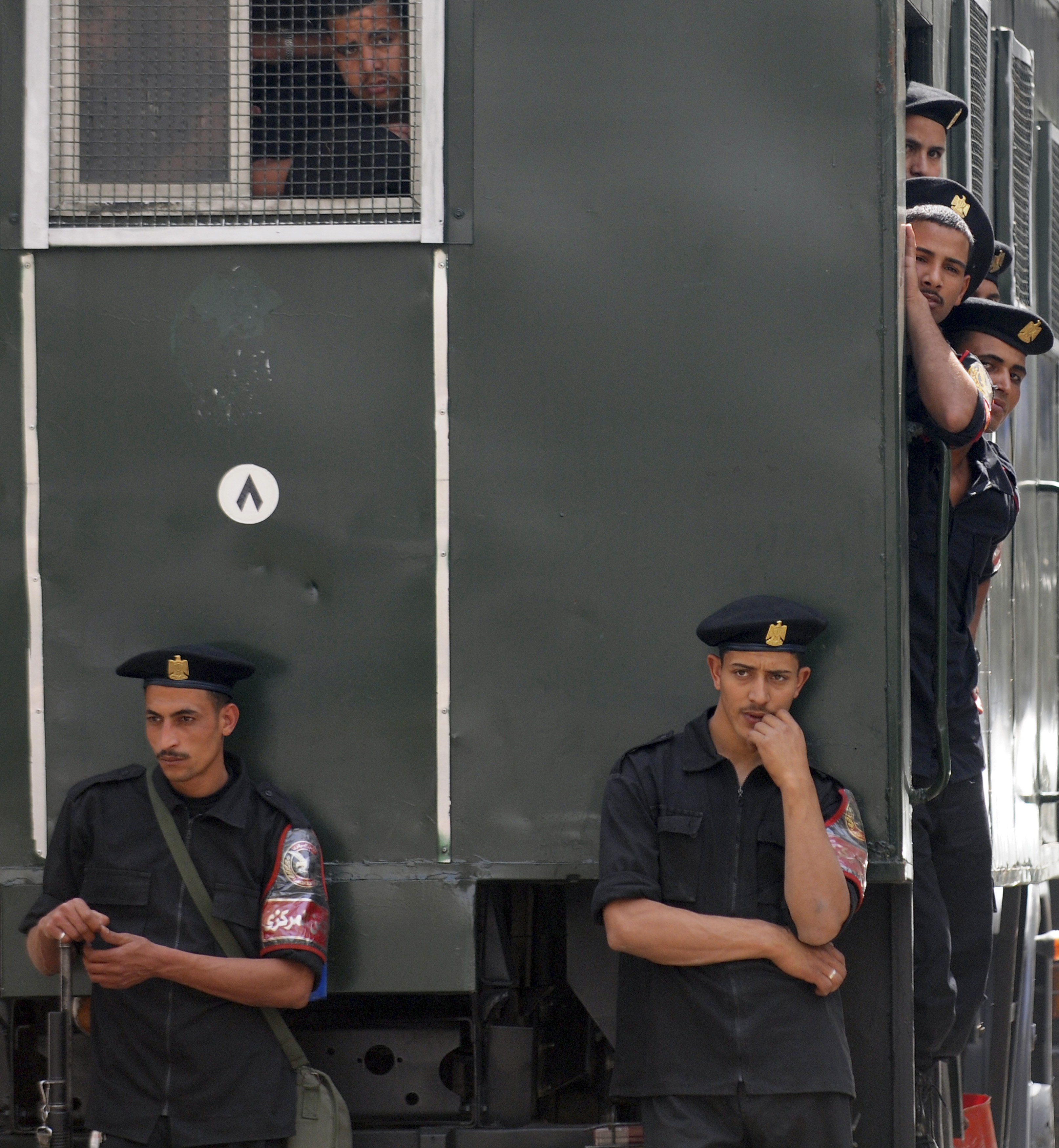 Egyptian police attend the first session of the trial of Ahmed Abu Duma, an activist and opposition writer, at Abdin Court in Cairo May 8, 2010. Abu Duma was arrested on May 3, 2009 in a demonstration organized by the opposition and political leaders against the decades-old emergency law that permits indefinite detentions. His charges include vandalism and assault on civil employees, according to his lawyer Osama Sedqi. REUTERS/Mohamed Abd El-Ghany (EGYPT - Tags: POLITICS CIVIL UNREST CRIME LAW)