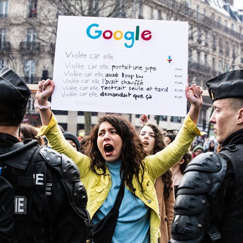 A protester holds a sign with a google search with the reasons for a rape. Feminist demonstration on 8 March 2020 in Paris for the international day of struggle for women s rights, under the rallying cries "Great winners", "We all stop". Paris, France, Sunday, March 08, 2020.