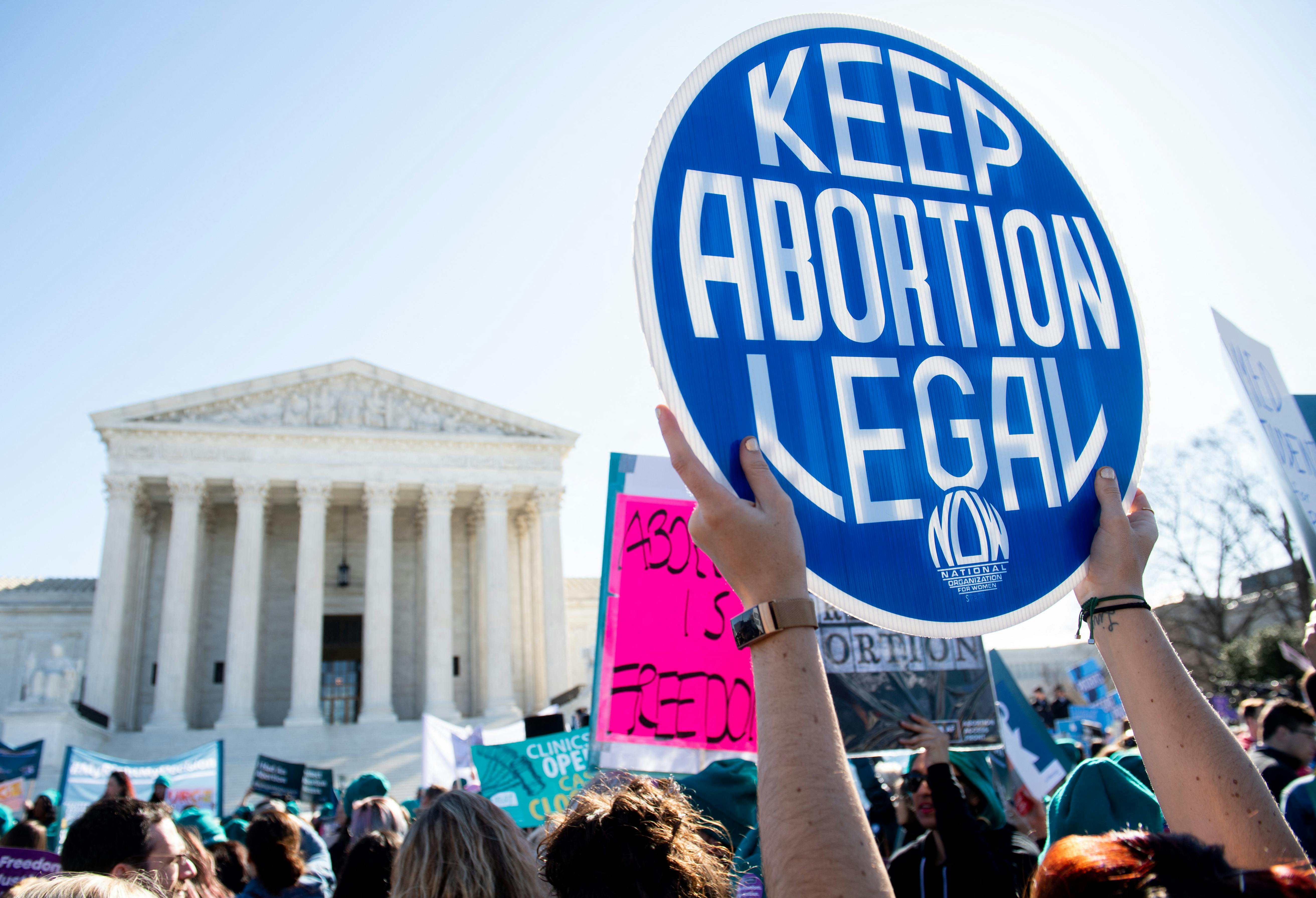 Pro-choice activists supporting legal access to abortion protest during a demonstration outside the US Supreme Court in Washington, DC, March 4, 2020, as the Court hears oral arguments regarding a Louisiana law about abortion access in the first major abortion case in years. - The United States Supreme Court on Wednesday will hear what may be its most significant case in decades on the controversial subject of abortion. At issue is a state law in Louisiana which requires doctors who perform abortions to have admitting privileges at a nearby hospital. (Photo by SAUL LOEB / AFP)