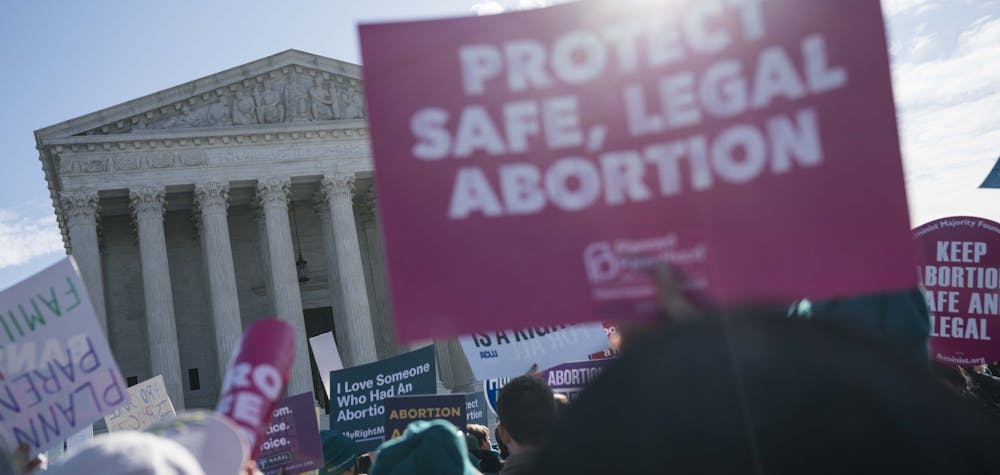 WASHINGTON, DC - MARCH 04: People participate in an abortion rights rally outside of the Supreme Court as the justices hear oral arguments in the June Medical Services v. Russo case on March 4, 2020 in Washington, DC. The Louisiana abortion case is the first major abortion case to make it to the Supreme Court since Donald Trump became President. Sarah Silbiger/Getty Images/AFP 
Sarah Silbiger / GETTY IMAGES NORTH AMERICA / Getty Images via AFP