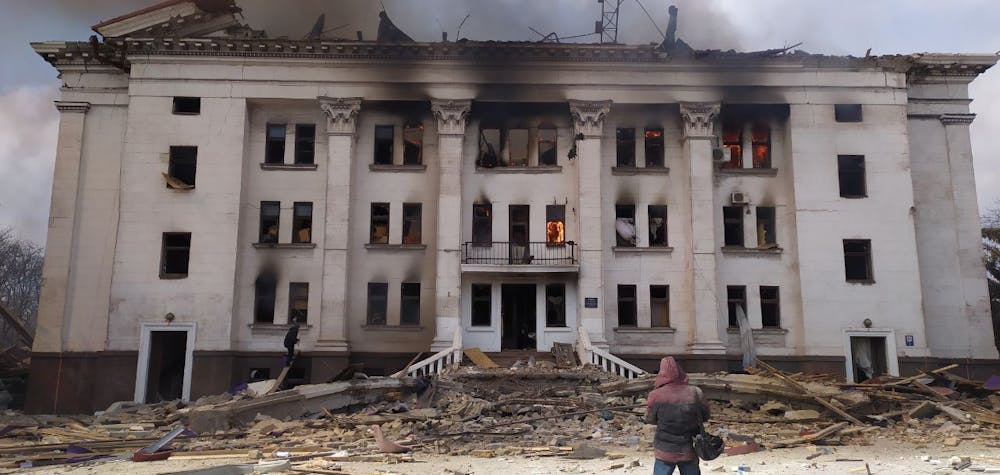 Serhii Zabohonskyi, an actor who used to perform at the theatre and a survivor of the attack, stands outside the rear of the theatre moments after the explosion.