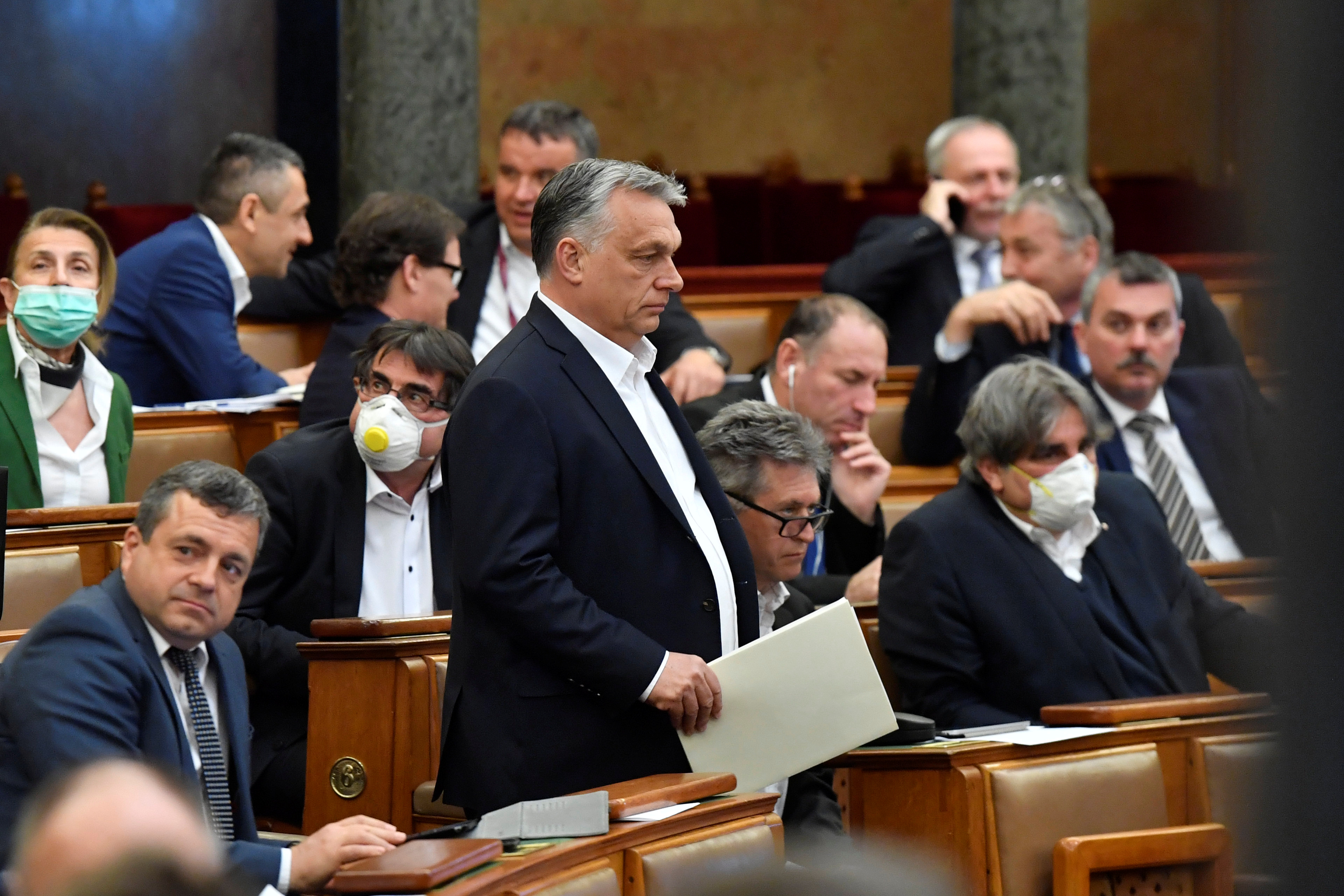 Hungarian Prime Minister Viktor Orban arrives to attend the plenary session of the Parliament ahead of a vote to grant the government special powers to combat the coronavirus disease (COVID-19) crisis in Budapest, Hungary, March 30, 2020. 