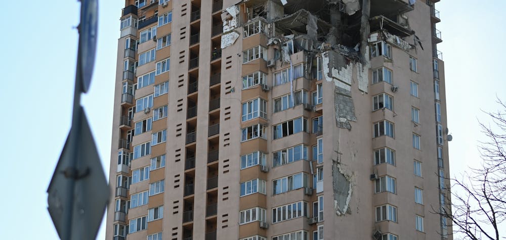 Damage to a building is seen after a rocket strike on an apartment building in Kyiv, Ukraine on Feb. 26, 2022. The strike happened in the early hours of the morning on Feb. 26, 2022 with an unknown number of dead and injured. Russia continued its offensive into Ukraine during the night with rocket attacks and deployment of ground troops in multiple areas. (Photo by Justin Yau/Sipa USA)No Use Germany.

