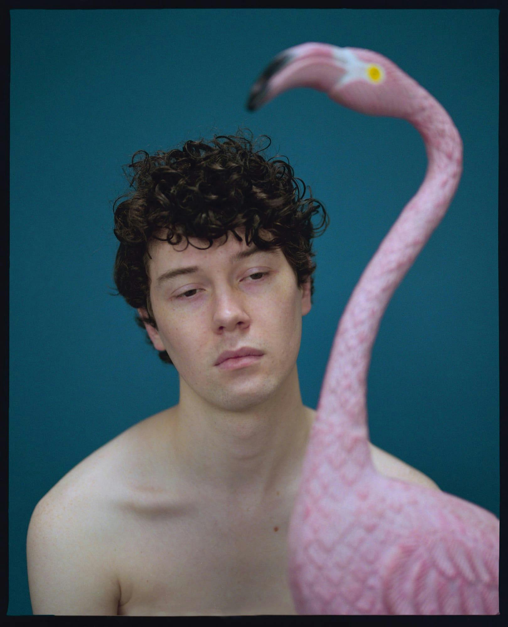 Elliot next to a flamingo