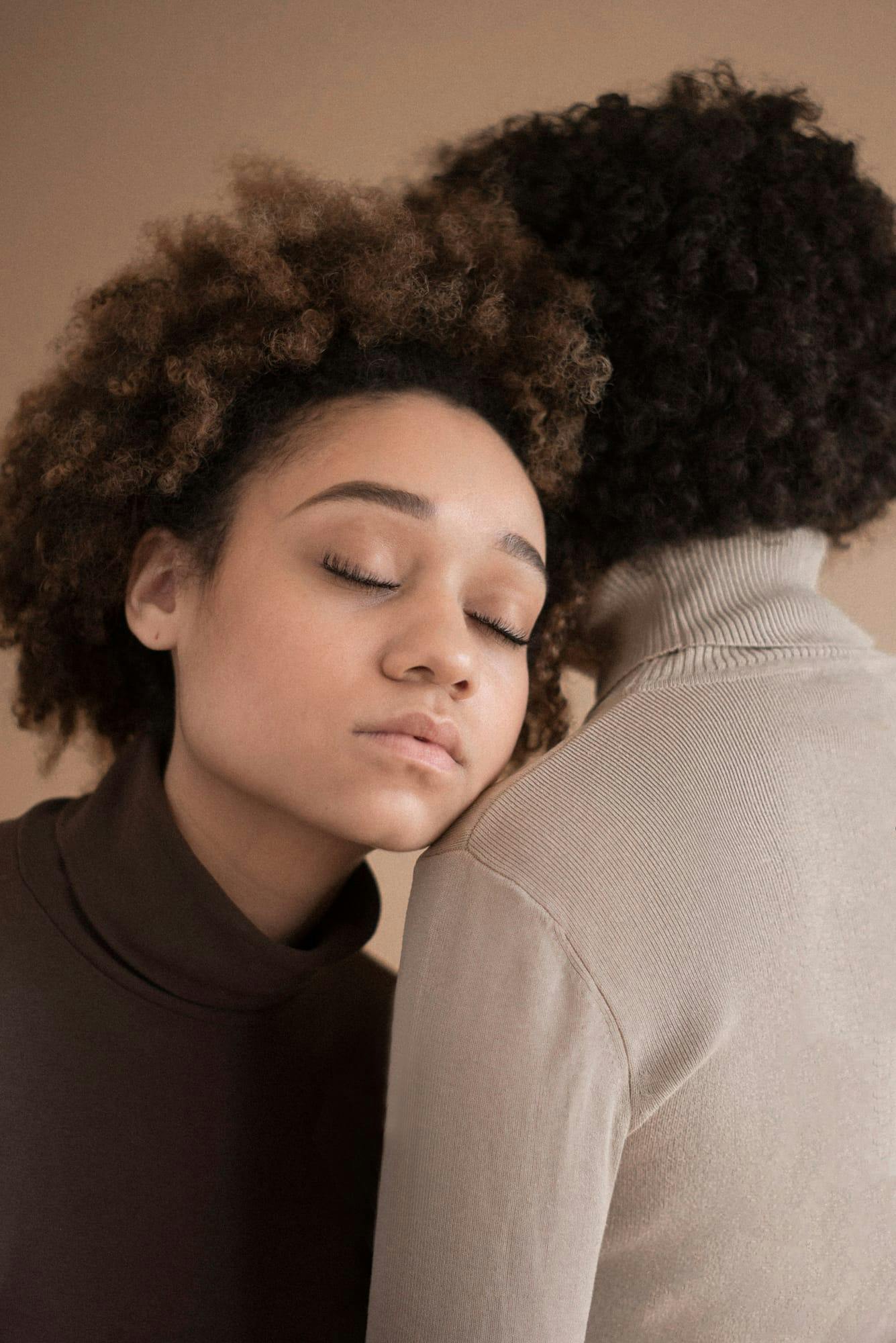 Two women hugging. 