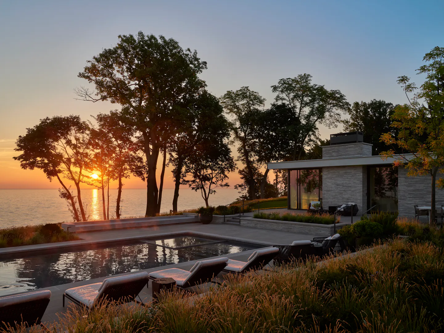 Yu Andrea Goldman Luxury Interior Design Firm Chicago The Evergreen House Exterior Pool Sunset