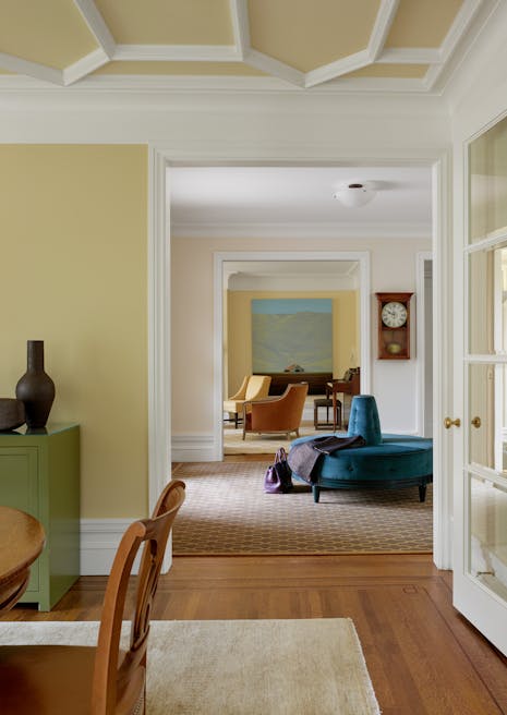 Andrew-Mann-Architecture-California-Spanish-Blue-Sofa-Foyer-into-Dining-Room
