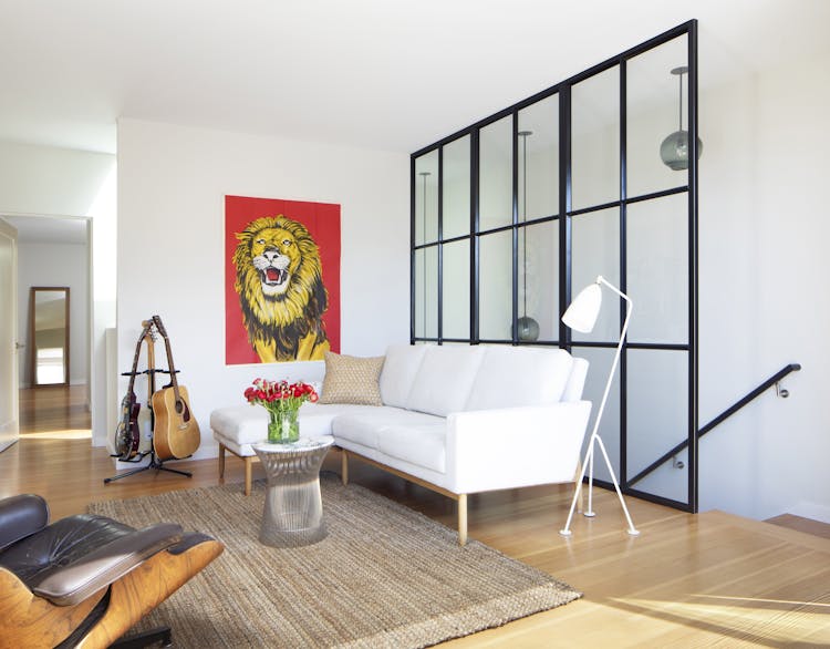 Andrew-Mann-Architecture-California-Historic-Cottage-Row-Lounge-with-Lion-Poster