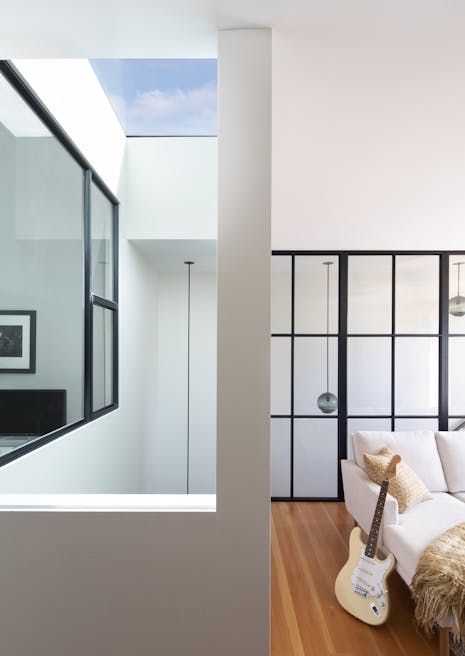 Andrew-Mann-Architecture-California-Historic-Cottage-Row-Skylight-view from-Lounge